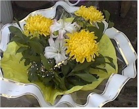 Russian girls enjoy receiving flowers and sweets at the same time.