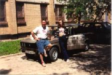 Craig and Arina Rich standing with their new '2000 model Zhiguli auto made at the VAZ plant in Togliatti.